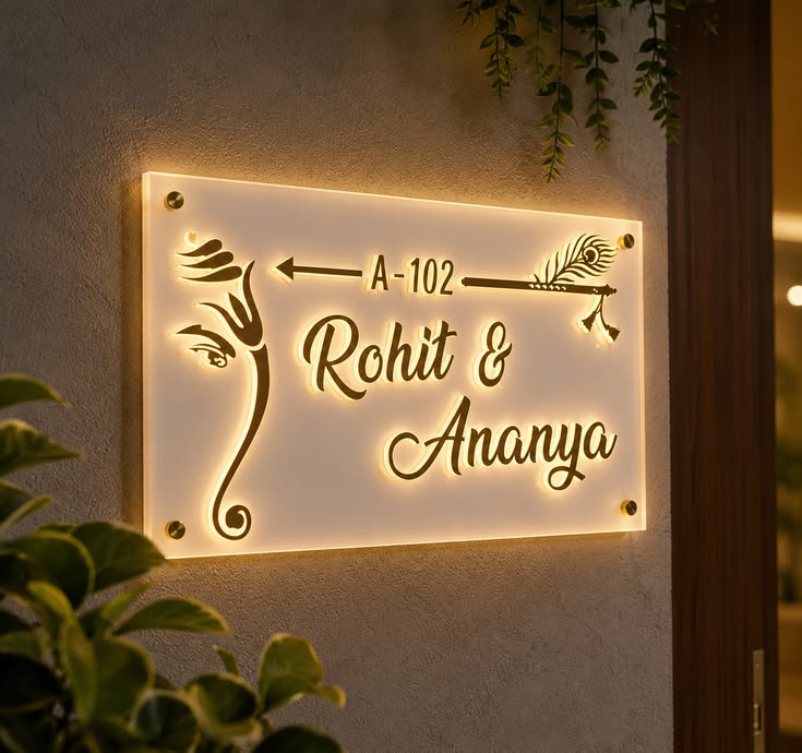 Pinterest reference of a cream nameplate with raised gold lettering and warm lighting
