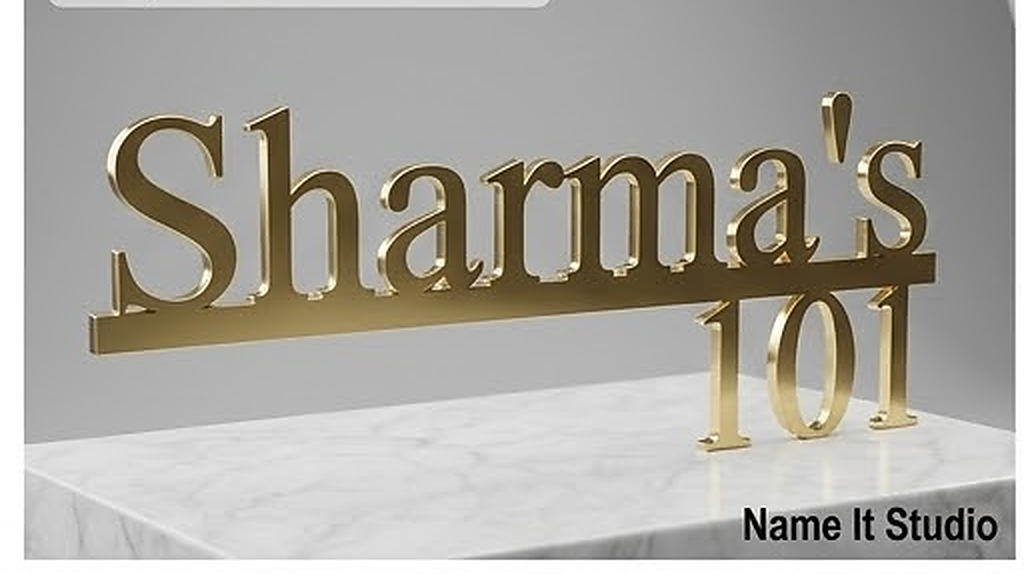 Sharma Brass: Polished brass-style raised lettering with a house number on a clean horizontal plate.