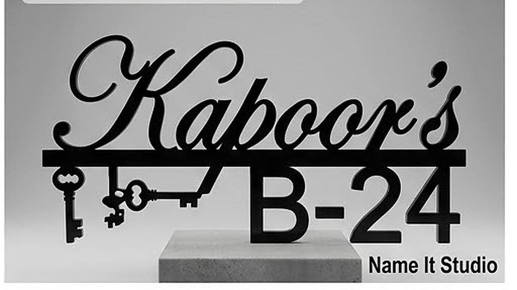 Kaboor Script: Matte black script lettering with a key motif and bold house number.