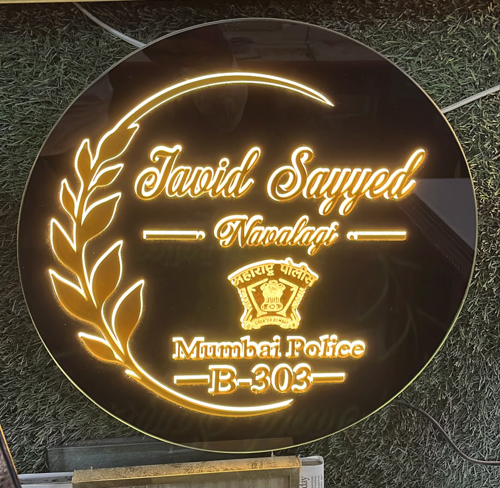 Original workshop photograph of a devotional illuminated nameplate made by Name It Studio